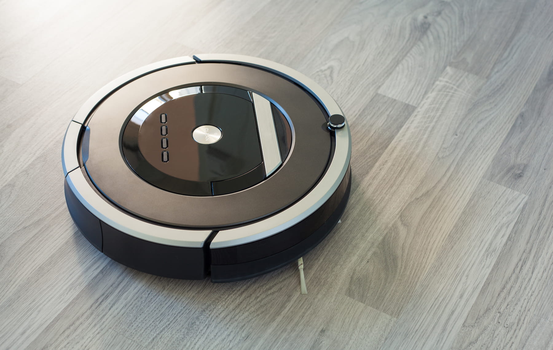 Robotic vacuum on a wood floor